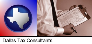 Dallas, Texas - a tax consultant holding an IRS form 1040