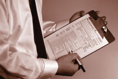 a tax consultant holding an IRS form 1040